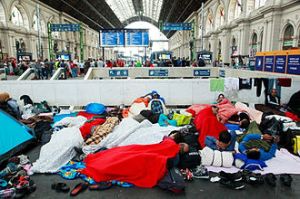 A railway station in Hungary is swamped by 'refugees' on their way to Norhern Europe
